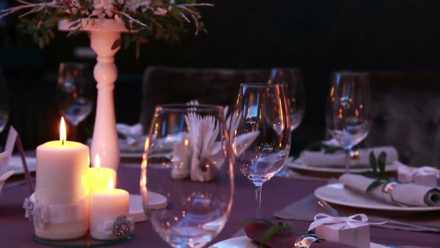 Luxury restaurant table layout with red roses for a romantic dinner