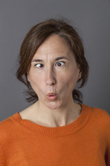 middle aged woman with cross-eyed funny face for humor