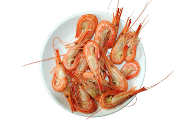 red boiled shrimps on a white saucer. Isolated on white