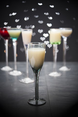 eggnog in liqueur glasses on a dark background 