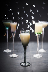 eggnog in liqueur glasses on a dark background 