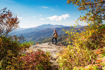 Man walking on the edge of a cliff