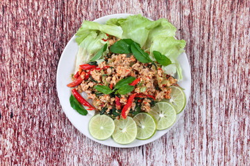 Home made,Spicy sour minced green mango salad with shrimp topped sliced green lemon,Chinese orange and lettuce. 