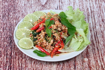 Home made,Spicy sour minced green mango salad with shrimp topped sliced green lemon,Chinese orange and lettuce. 