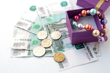 Box with a pearl bracelet and Russian money  