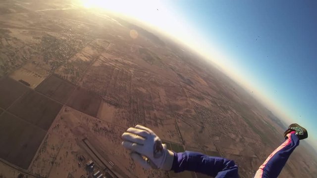 Professional skydiver open parachute above sandy arizona. Landscape. Sunny. Extreme sport