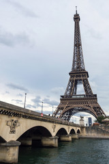 Fototapeta na wymiar View Eiffel Tower in Paris. Cloudy day