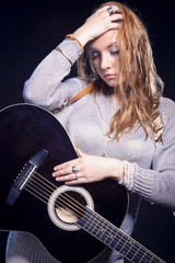 Musical Concepts and Ideas. Portrait of Caucasian Blond Female Posing Against Black