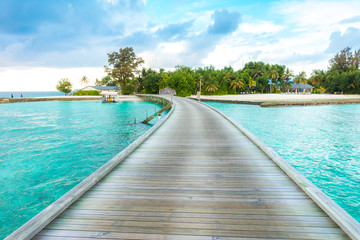 Beautiful tropical Maldives resort hotel with beach and blue wat
