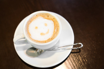 Latte Coffee art on the wooden table