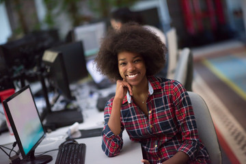 Fototapeta na wymiar portrait of a young African American woman in modern office