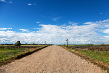 Railroad crossing in rural North Dakota on a summer day. 