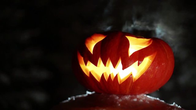 Burning pumpkin on Halloween. Looped