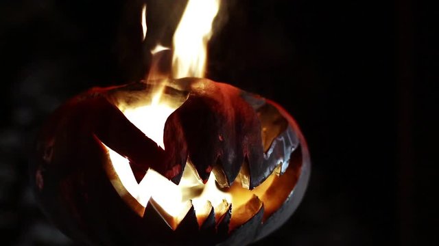 Burning pumpkin on Halloween. Looped