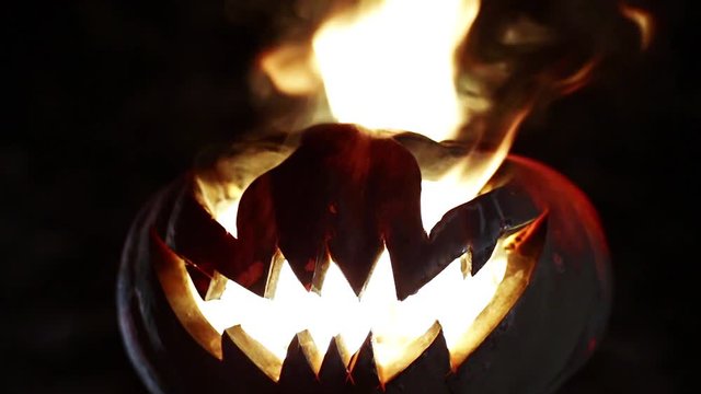 Burning pumpkin on Halloween. Looped