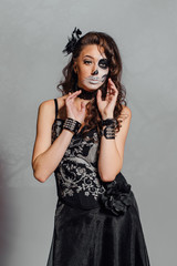 Fototapeta premium Portrait of young woman with skull make-up.