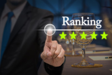 Businessman pointing five star button to increase ranking of hot