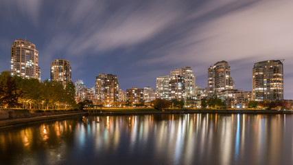 Obraz na płótnie Canvas city building lights reflections with Fall season backgrounds
