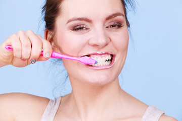 Woman brushing cleaning teeth