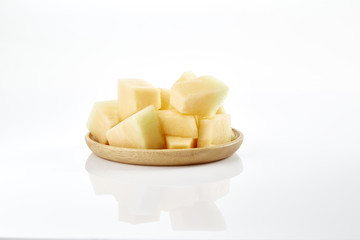 melon slice on wooden plate