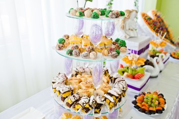 Wedding reception with fruits and cakes