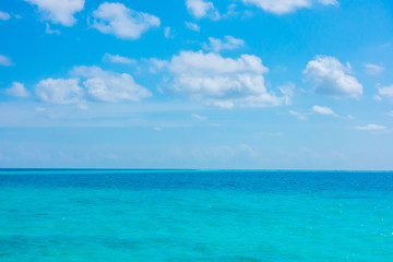 White clouds with blue sky over calm sea  in tropical Maldives i