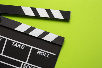 Obraz premium movie clapper on green background