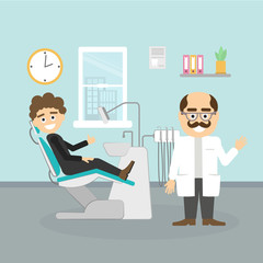 Dentist with patient. Smiling dentist with moustache and male patient at dental cabinet. Dental care and hygiene.