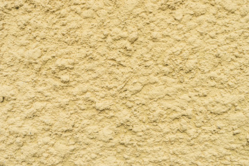 close up of yellow concrete surface texture
