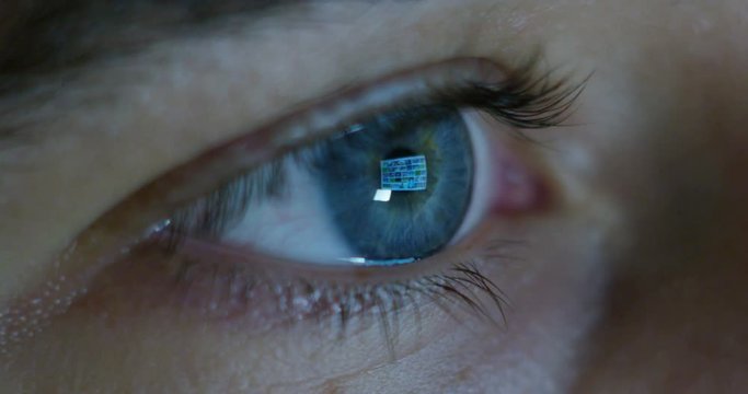 Close up of young businessman with blue eyes wearing the glasses looking on the waveform lines expressed concept of stock market, growth stock market, economic profits, stock exchange 