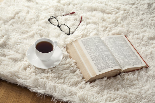 Reading Book With Coffee On Carpet