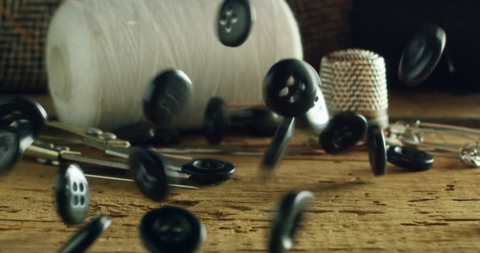 Slow motion of a hand of a young tailor who draws with a pencil in his study of the lives to be produced for the new collection