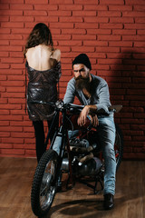 Fototapeta na wymiar bearded biker man on motorbike