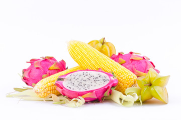  sweet corn cobs kernels and dragon fruit pitaya and star fruit carambola  on white background  fruit and vegetable isolated
