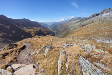 trekking in the Italian Alps; it's autumn with no people around