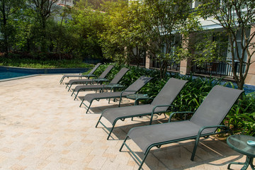Swimming pool with beach chairs