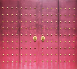traditional chinese temple with guardian door knockers