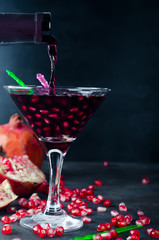 Pouring drink into a glass