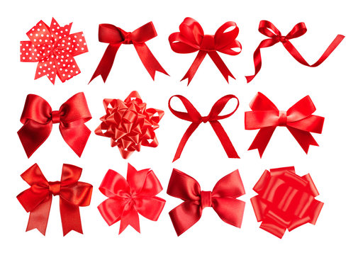 Set of red festive bows on white background