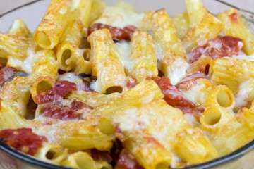 Cooked pasta with cheese and sauce