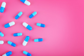 Color pills on pink background
