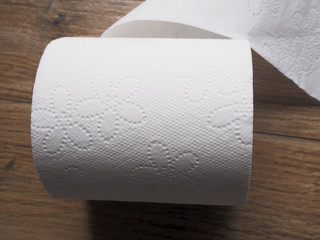  Toilet paper on wood background