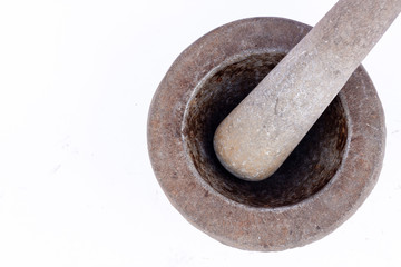 old granite stone mortar and pestle are Thai cooking tool on white background food isolated ( top view )
