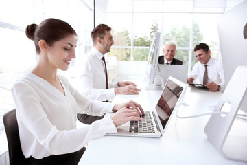 Business training concept. Colleagues working on computers at office