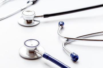 two modern stethoscope on white background