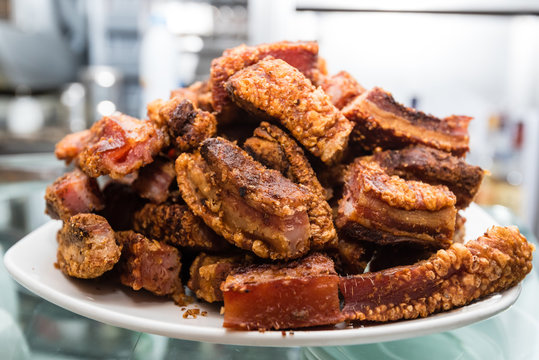 A delicious bunch of spanish typical food "torreznos" (fried pork) ready to be served as tapas at a local bar.