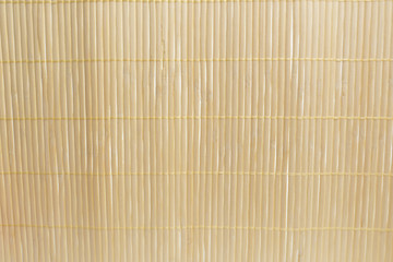 Brown bamboo mat on white kitchen table background