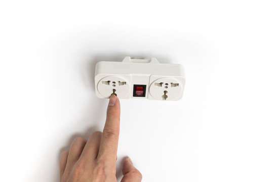 Finger pointing to power plug socket