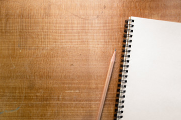 Top view of notebook on wood background