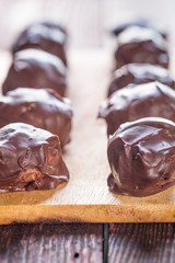 Homemade Paleo Chocolate Truffles on Dark Wooden Background